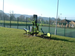 Photo of excersise equipment adjacent to the tennis courts